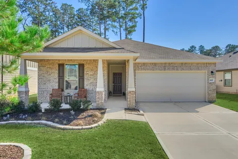 a front view of a house with a yard and porch