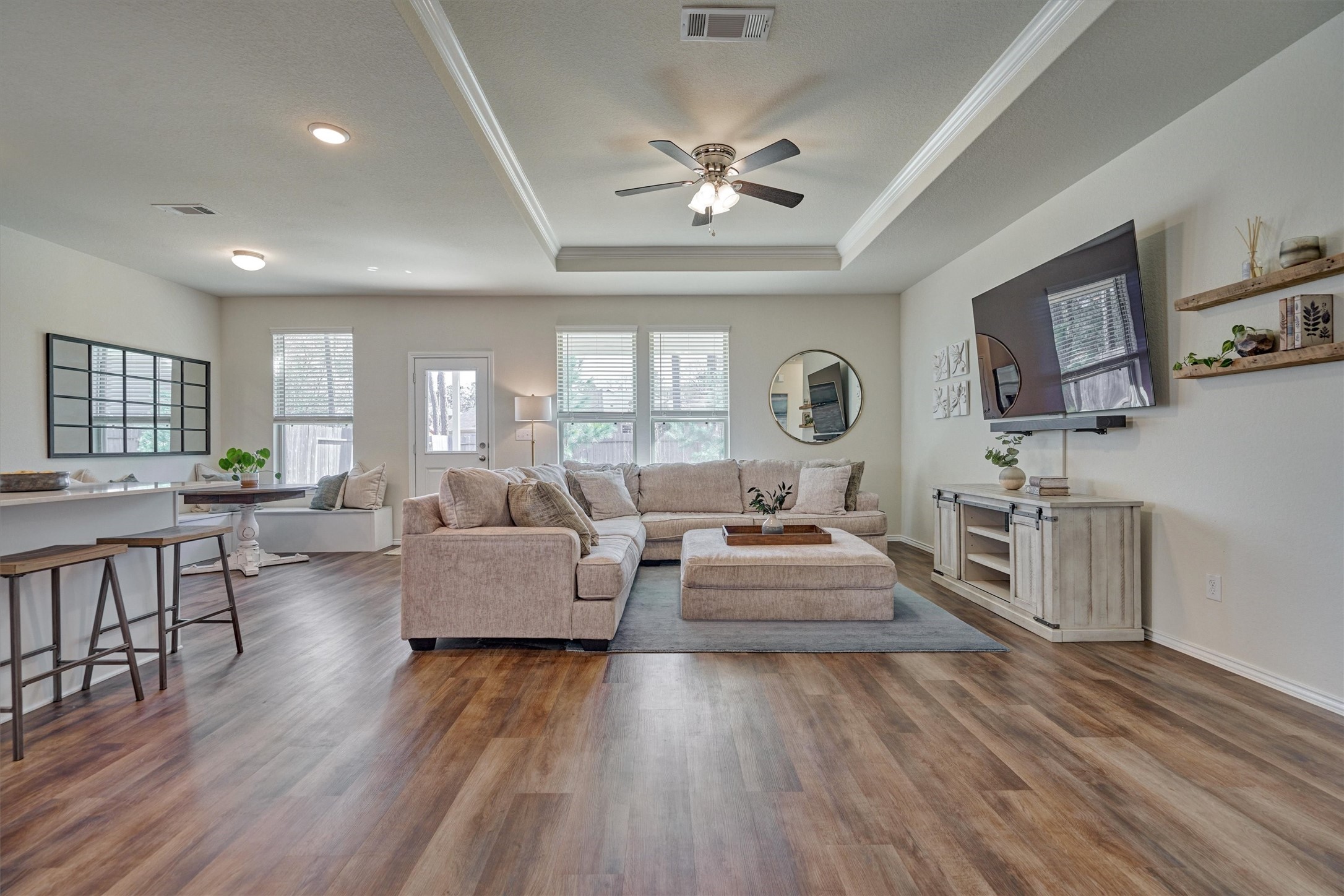 4417 Longleaf Timbers Court Conroe, TX 77304 - Photo 12 of 30 a living room with furniture and a wooden floor