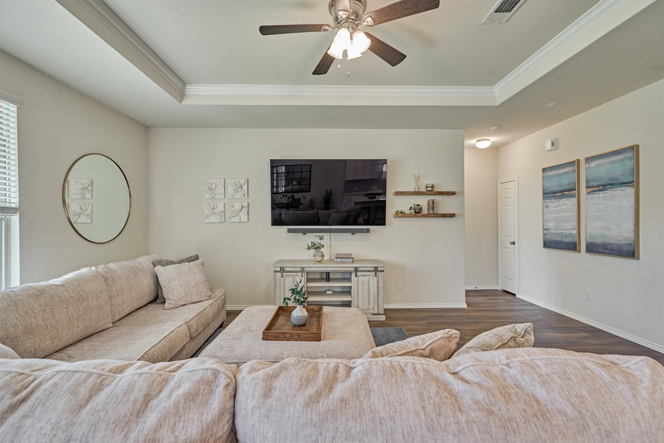 4417 Longleaf Timbers Court Conroe, TX 77304 - Photo 14 of 30 a bedroom with a bed a mirror and a flat tv screen on dresser