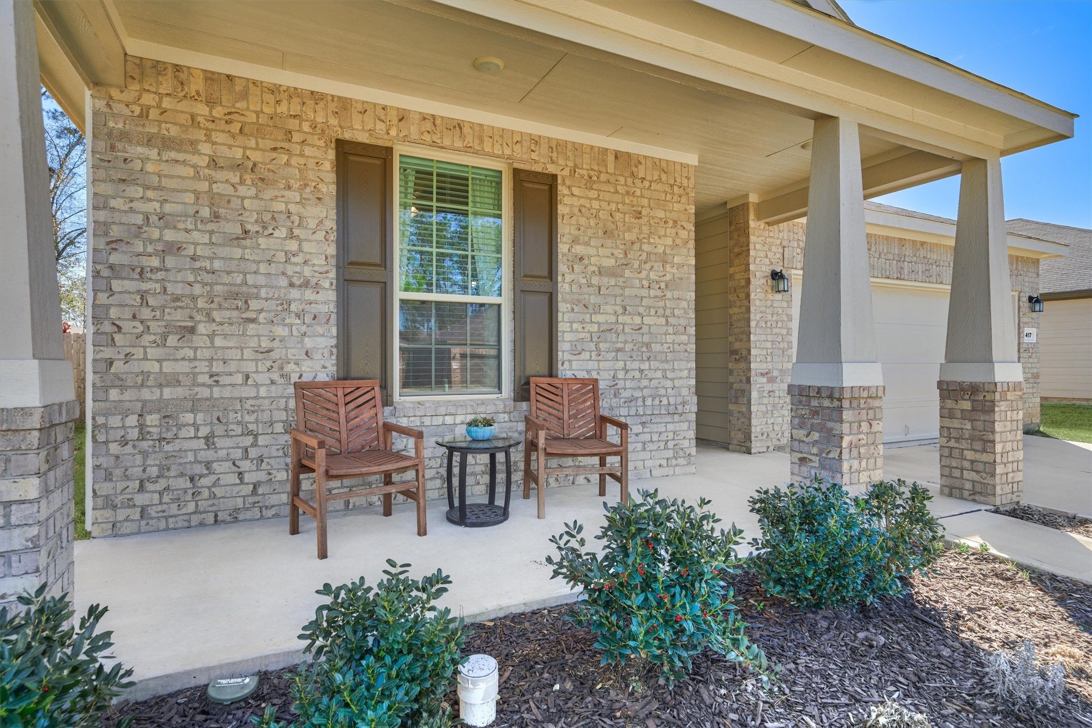 4417 Longleaf Timbers Court Conroe, TX 77304 - Photo 2 of 30 a view of a patio with chairs and table in a patio
