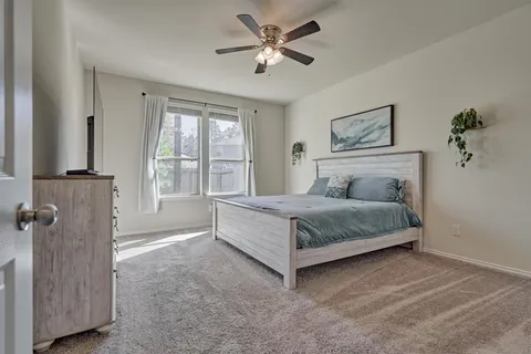 a bathroom with a double vanity sink toilet and shower