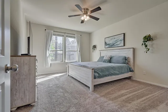 a bathroom with a double vanity sink toilet and shower