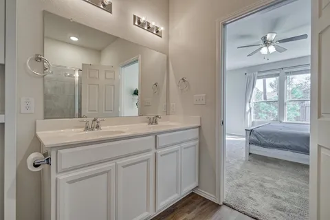 a bathroom with a glass shower door