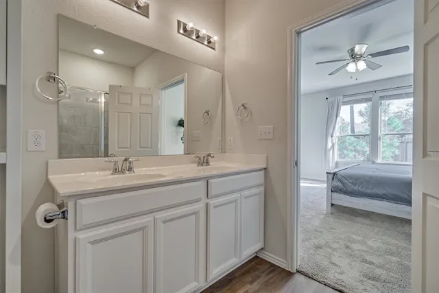 a bathroom with a glass shower door