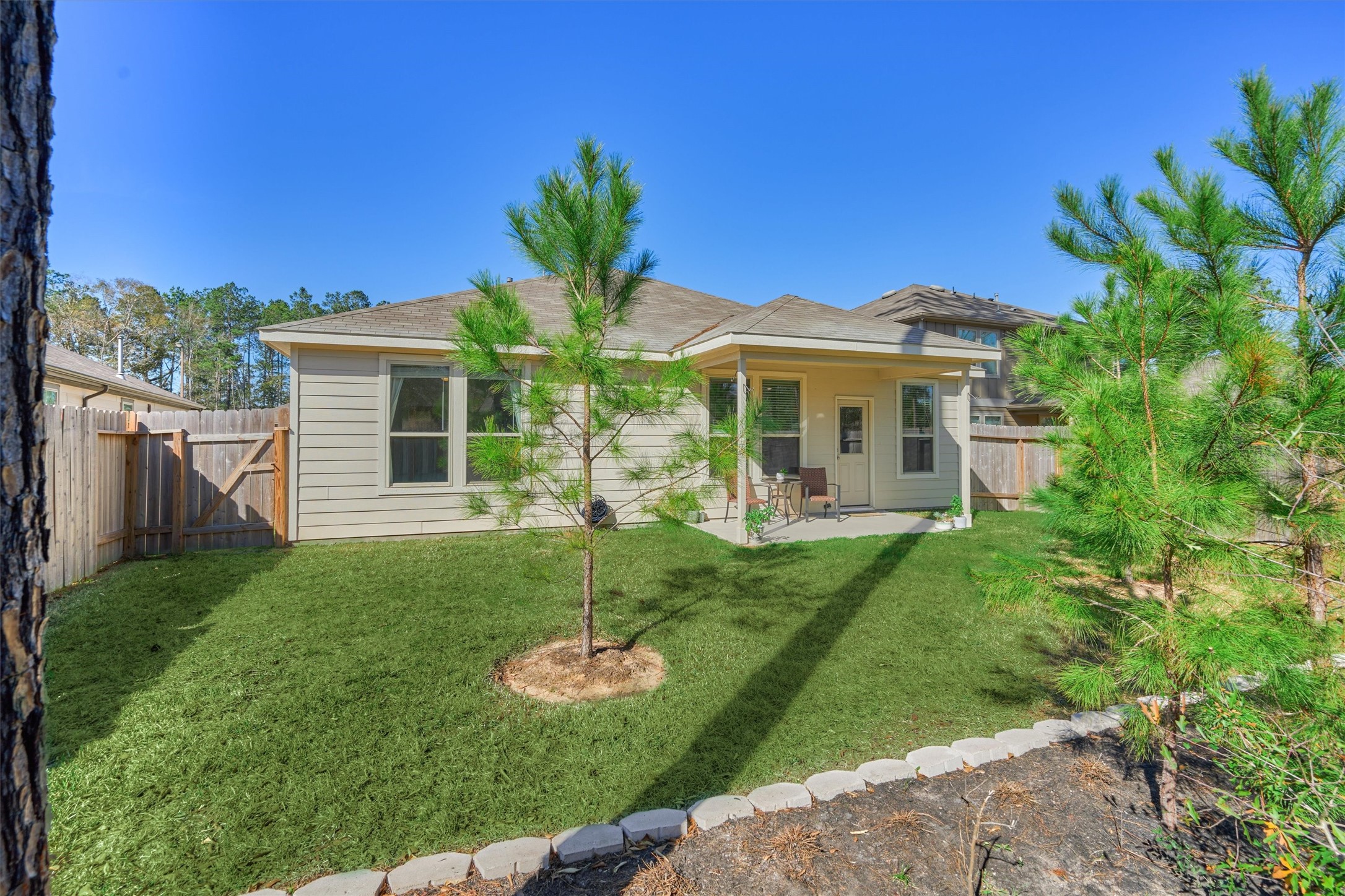 4417 Longleaf Timbers Court Conroe, TX 77304 - Photo 27 of 30 a front view of a house with a yard