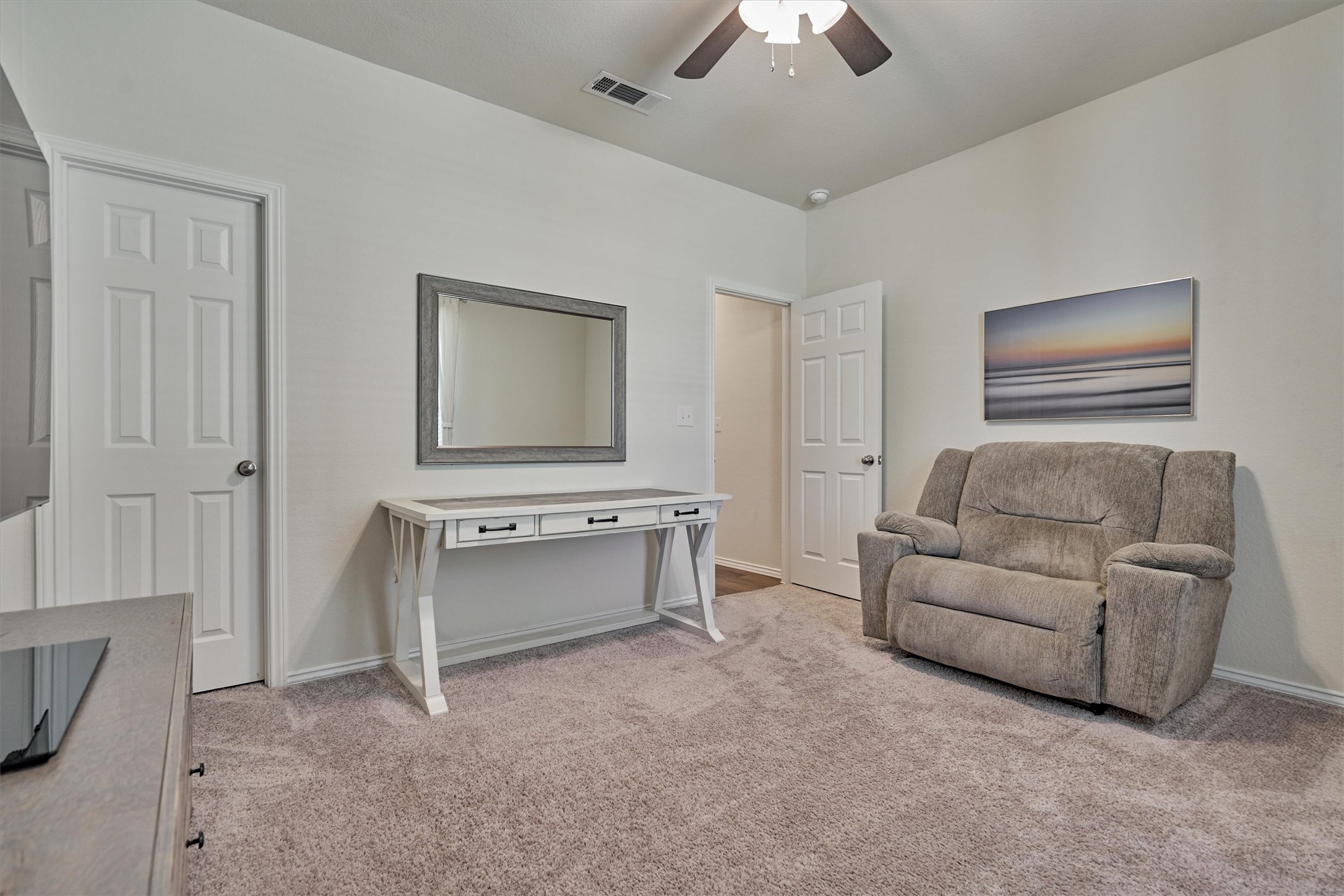 4417 Longleaf Timbers Court Conroe, TX 77304 - Photo 7 of 30 a living room with furniture and a ceiling fan