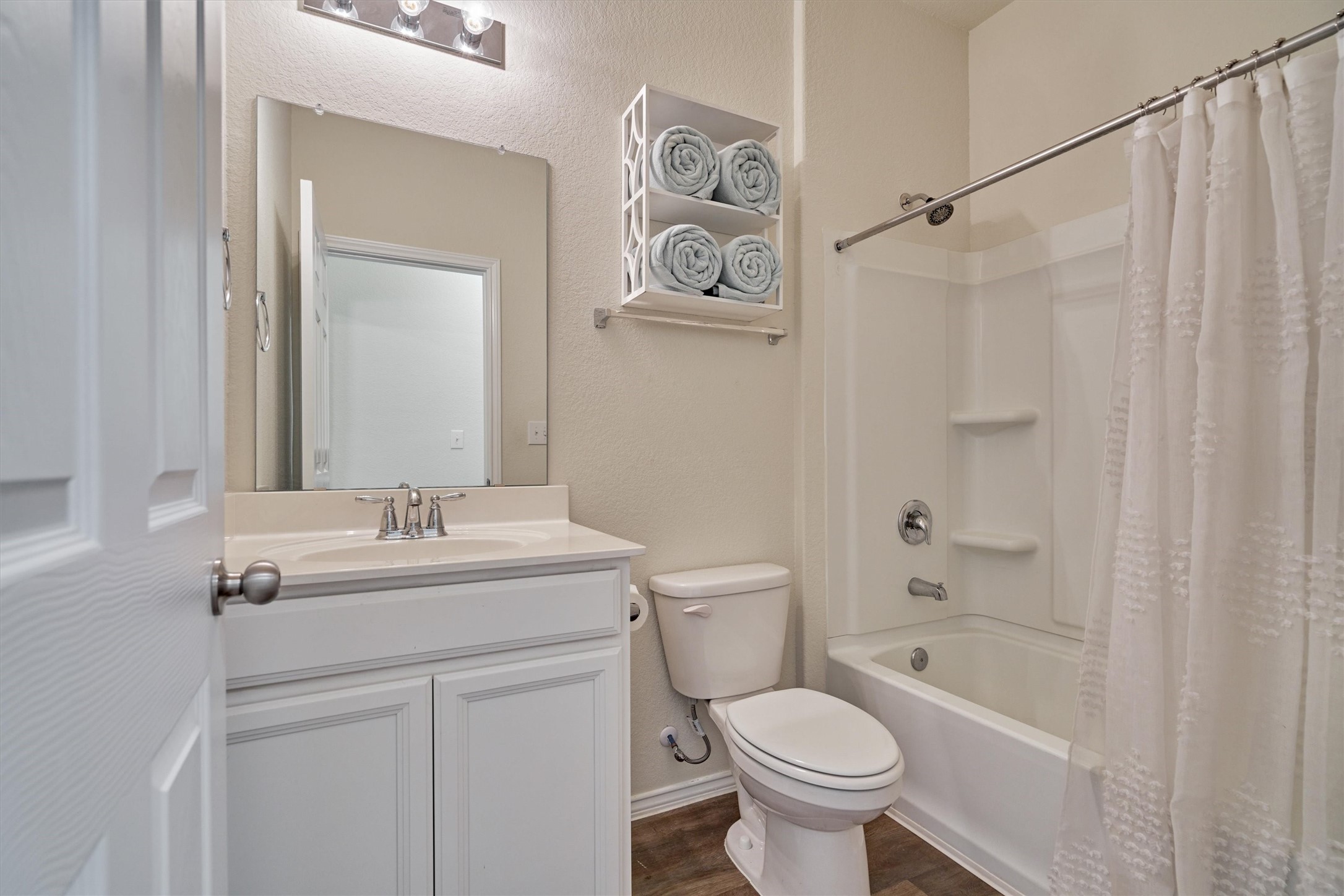 4417 Longleaf Timbers Court Conroe, TX 77304 - Photo 8 of 30 a bathroom with a sink toilet and shower