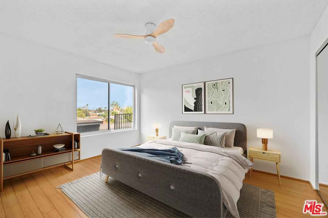 1517 East Garfield Avenue, Unit 23 Glendale, CA 91205 - Photo 6 of 14 a bedroom with a bed and a couch