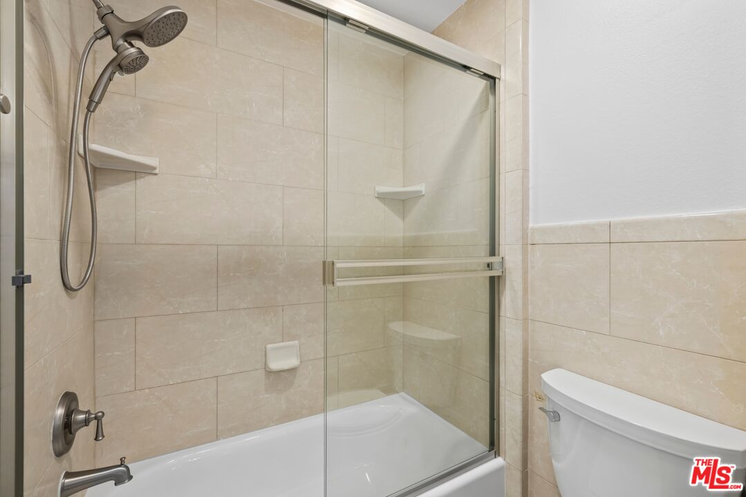 1517 East Garfield Avenue, Unit 23 Glendale, CA 91205 - Photo 9 of 14 a bathroom with a shower and toilet