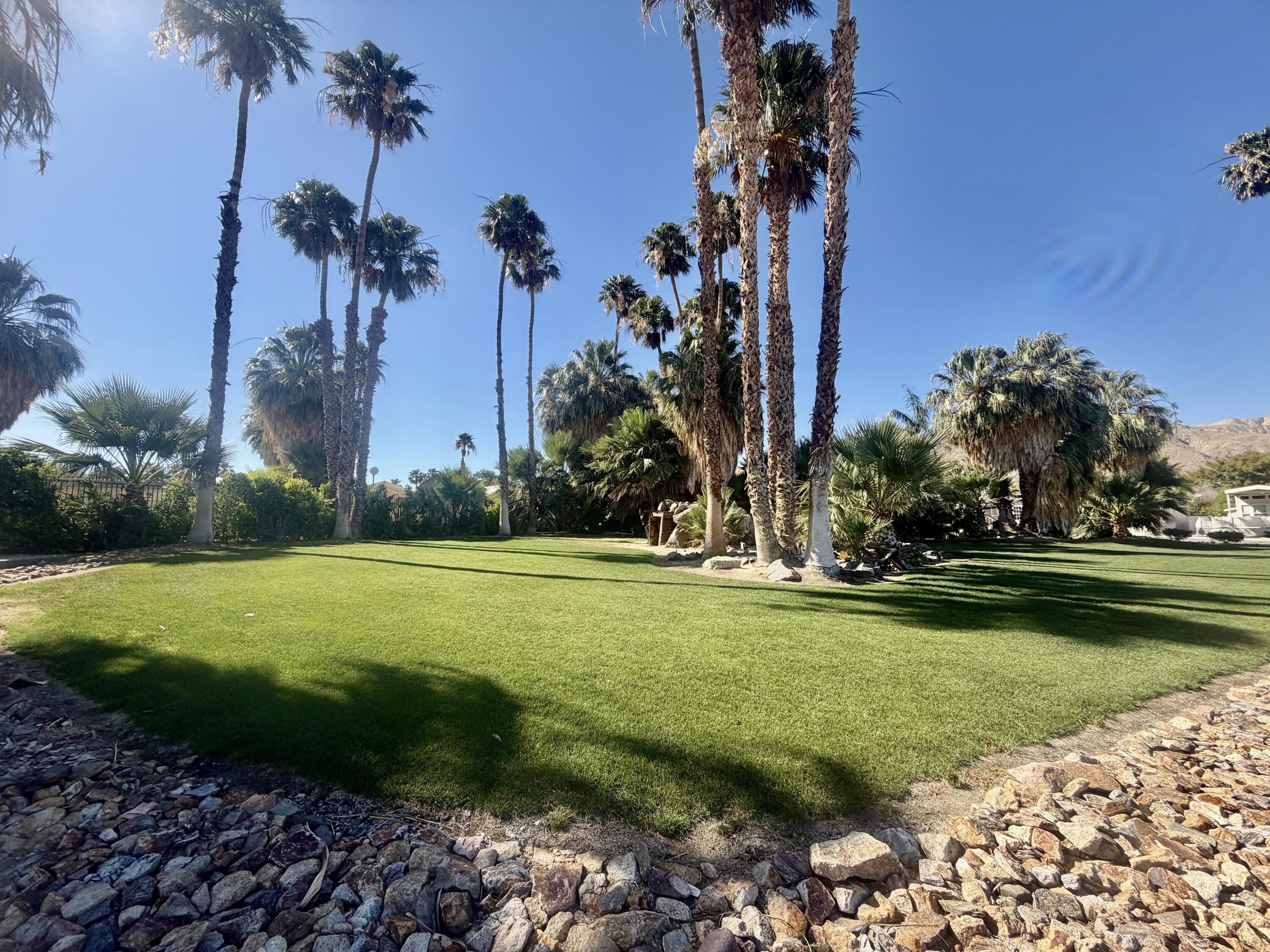 74711 Dillon Road, Unit 264 Desert Hot Springs, CA 92241 - Photo 8 of 21 a view of a golf course with a garden