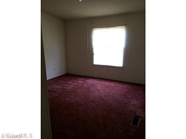 238 Coppley Road Linwood, NC 27299 - Photo 8 of 10 1st Bedroom.