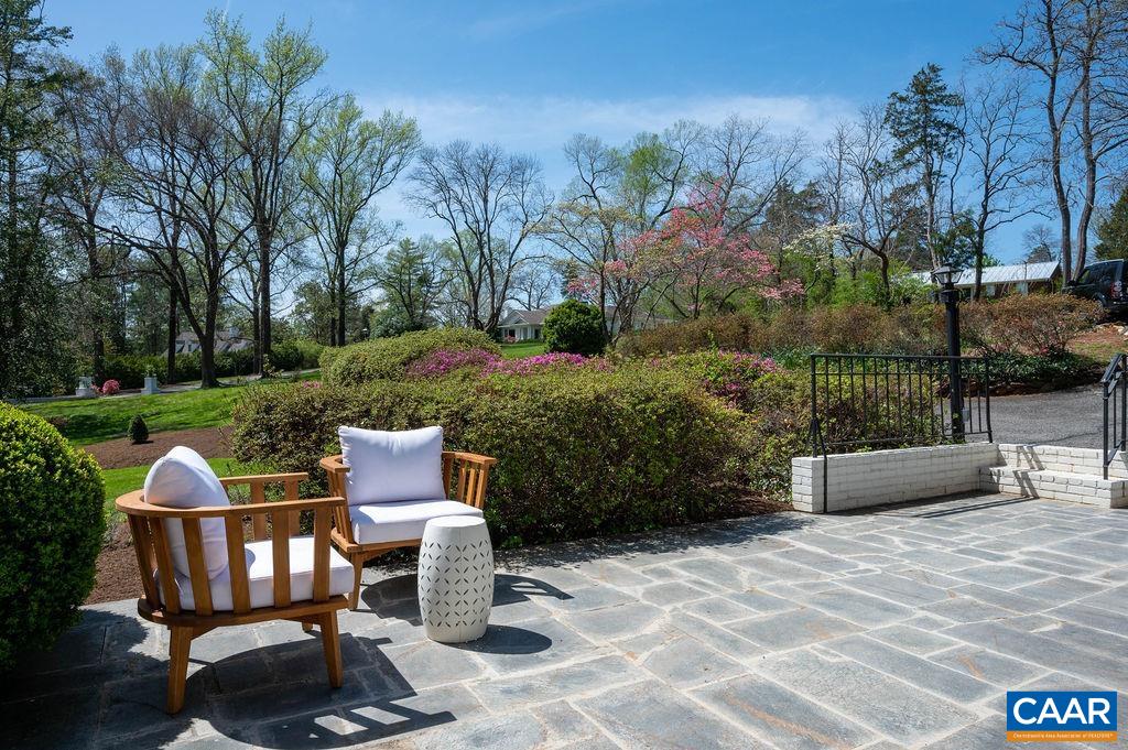 9 Old Farm Road Charlottesville, VA 22903 - Photo 8 of 35 a view of a chairs and table in backyard