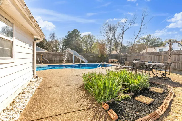a front view of a house with basket ball court