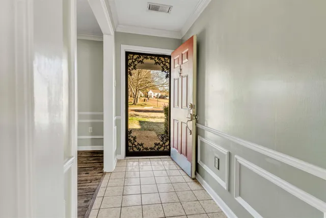 a view of a hallway with windows