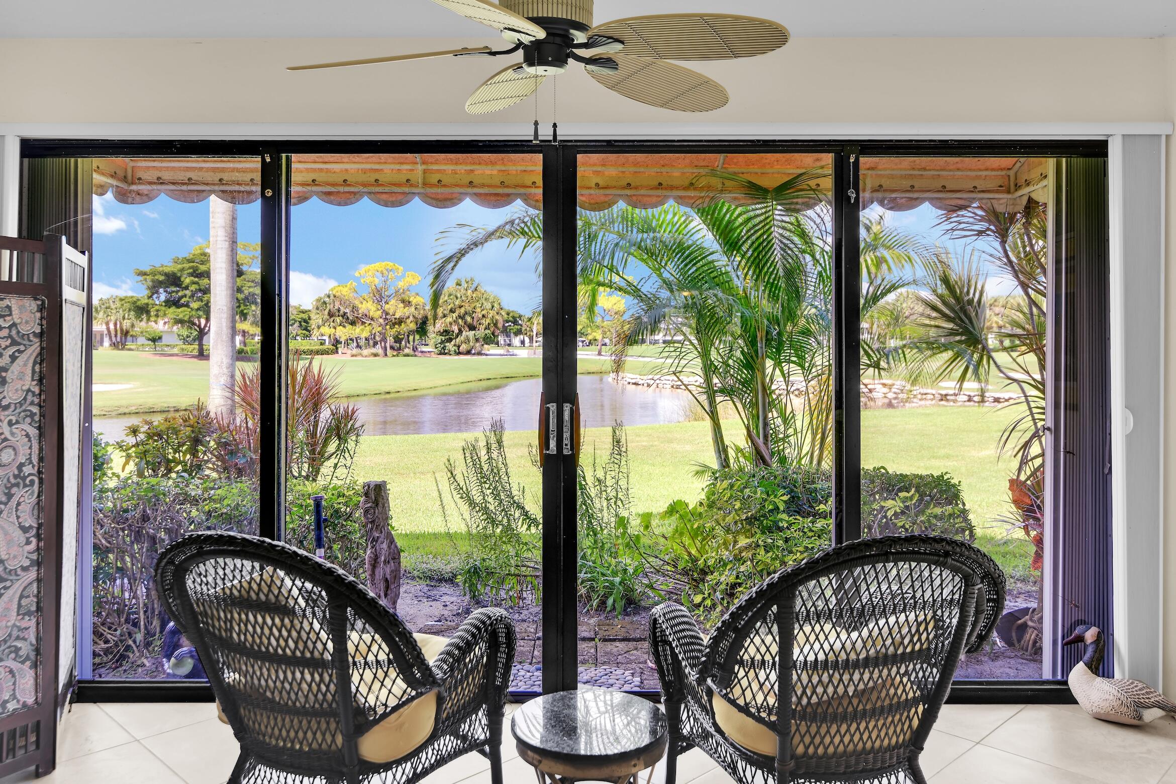 a view of a chairs and table in a balcony