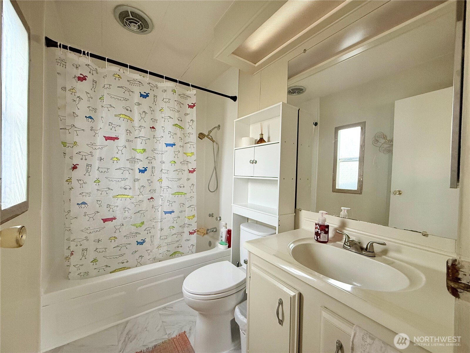 11622 Silver Lake Road, Unit 55 Everett, WA 98208 - Photo 13 of 21 a bathroom with a sink toilet and shower