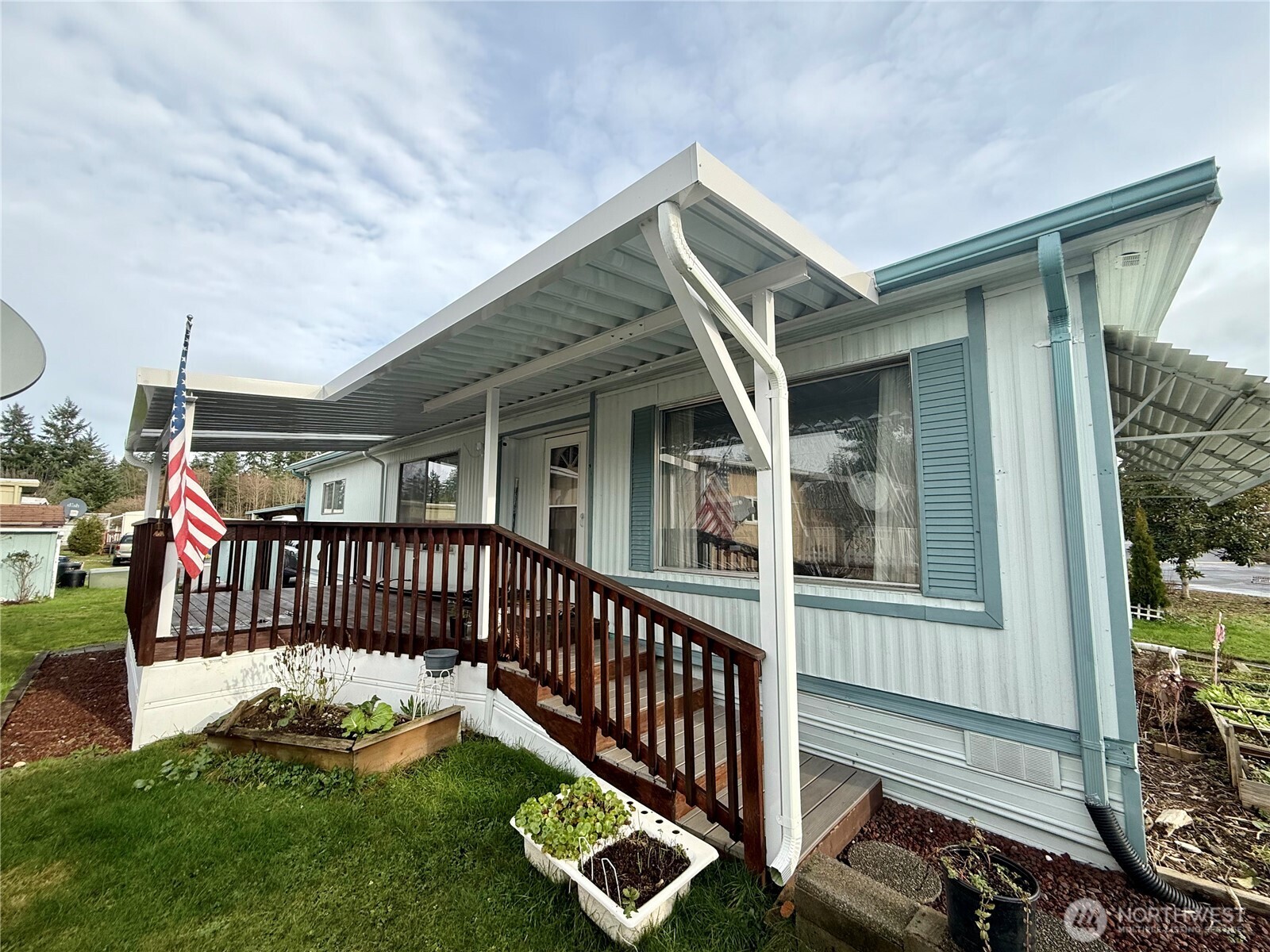 11622 Silver Lake Road, Unit 55 Everett, WA 98208 - Photo 18 of 21 a view of a house with a deck and a yard