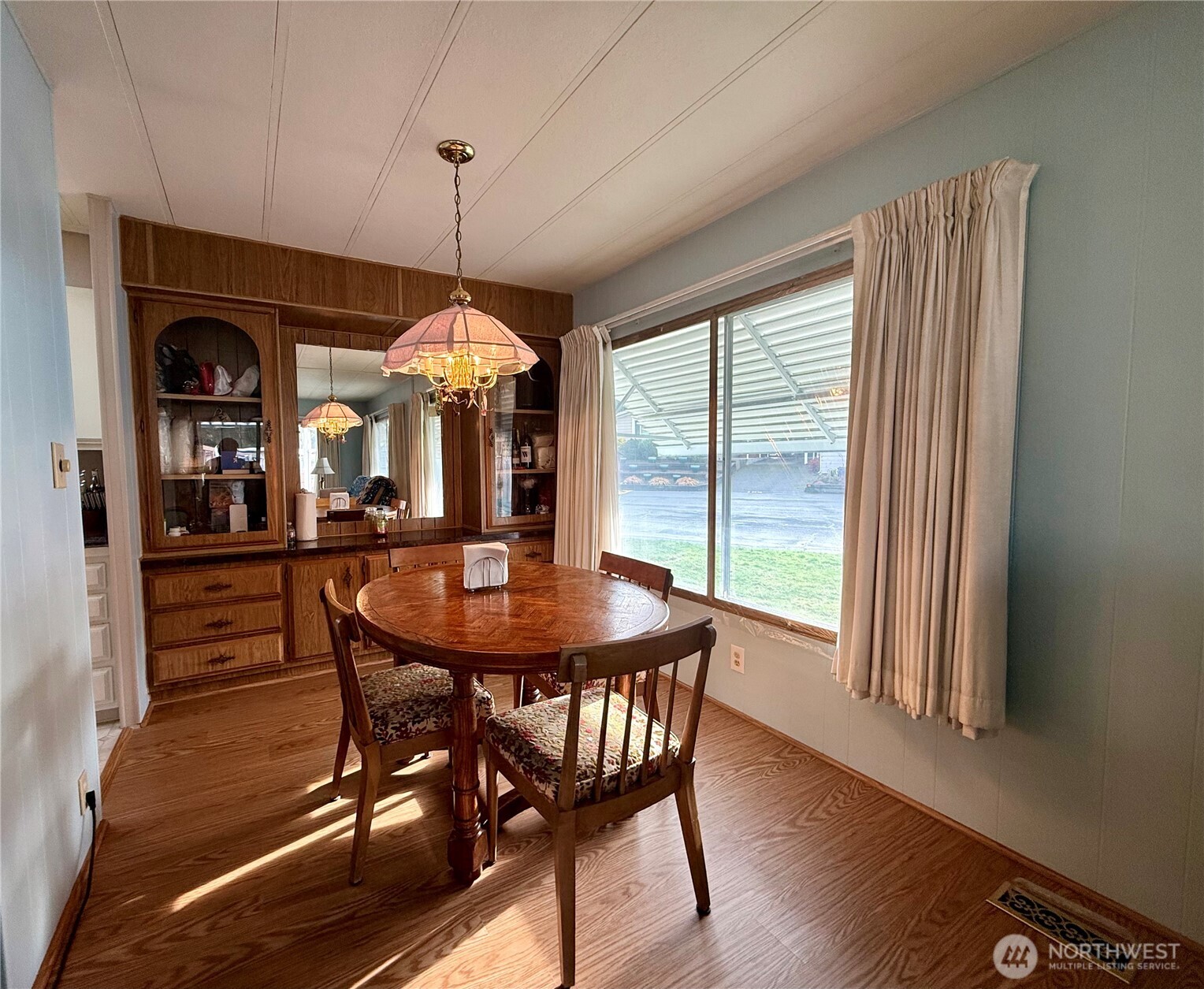 11622 Silver Lake Road, Unit 55 Everett, WA 98208 - Photo 3 of 21 a view of a dining room with furniture window and wooden floor