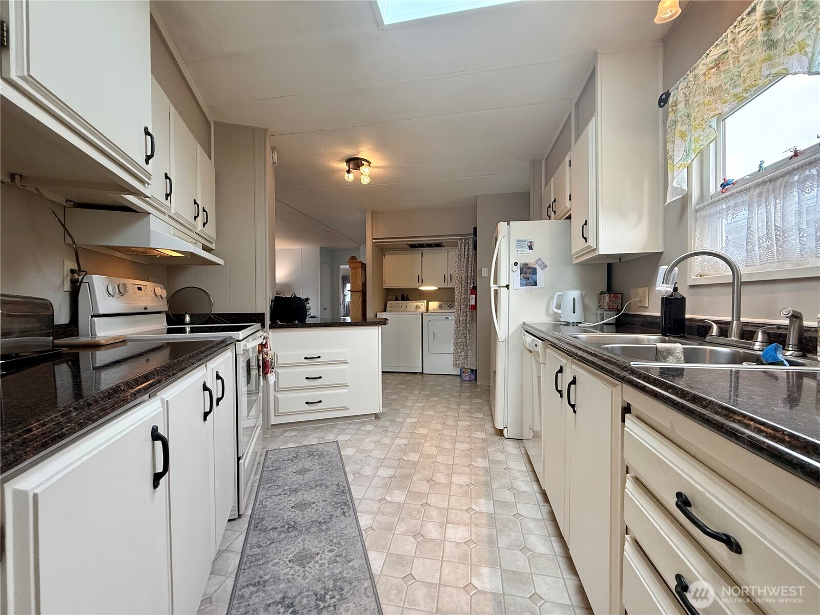 11622 Silver Lake Road, Unit 55 Everett, WA 98208 - Photo 8 of 21 a kitchen with stainless steel appliances granite countertop a sink and cabinets