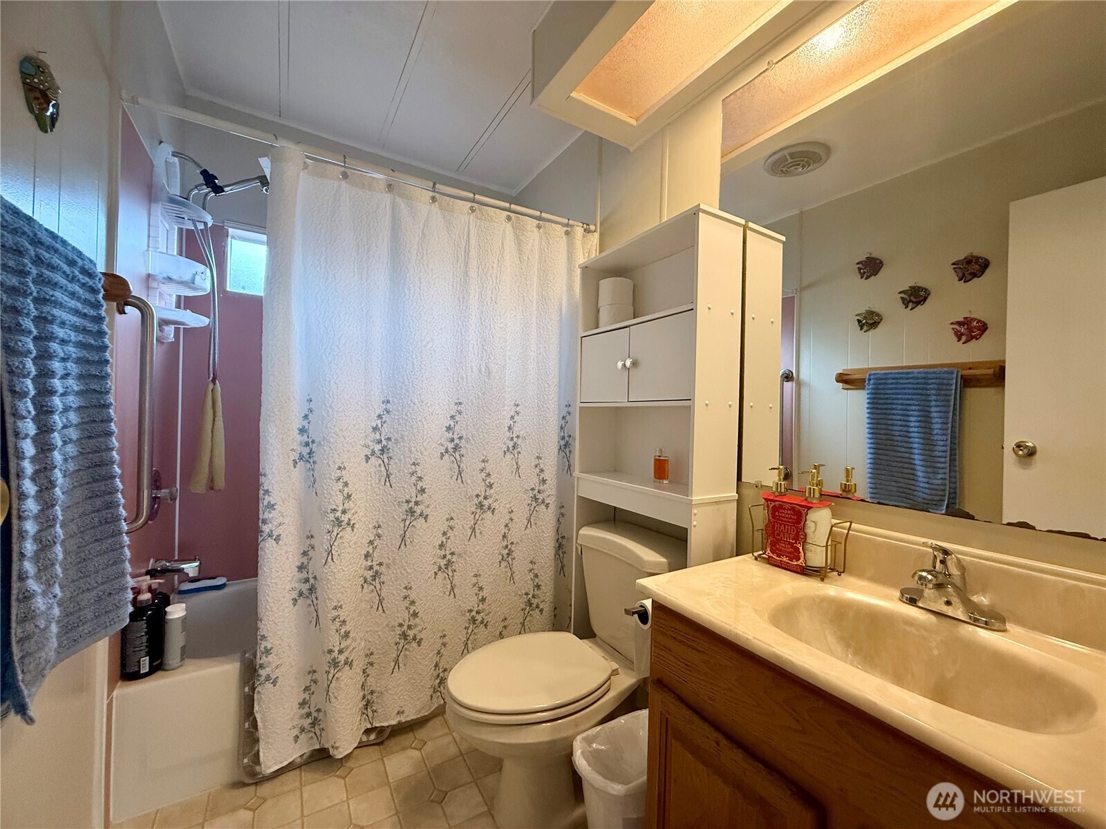 11622 Silver Lake Road, Unit 55 Everett, WA 98208 - Photo 10 of 21 a bathroom with a sink toilet and shower