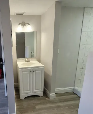 a bathroom with a sink and mirror