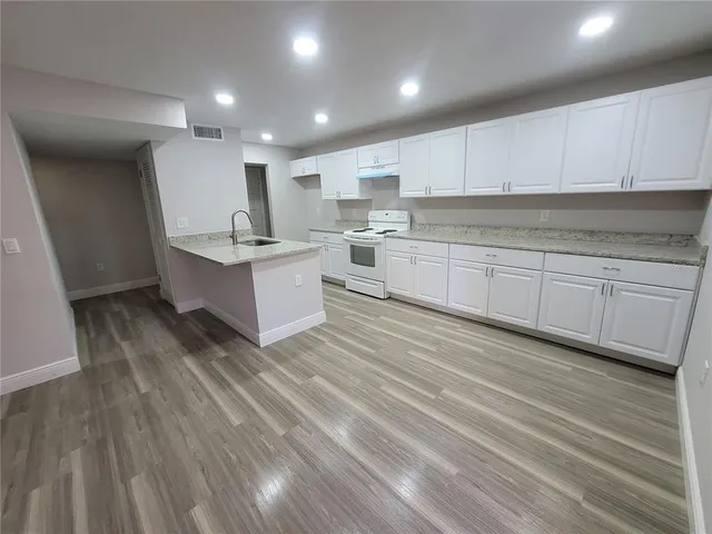 a large kitchen with cabinets
