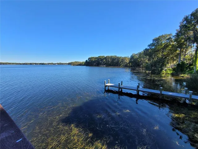a view of balcony with wooden floor and seating space