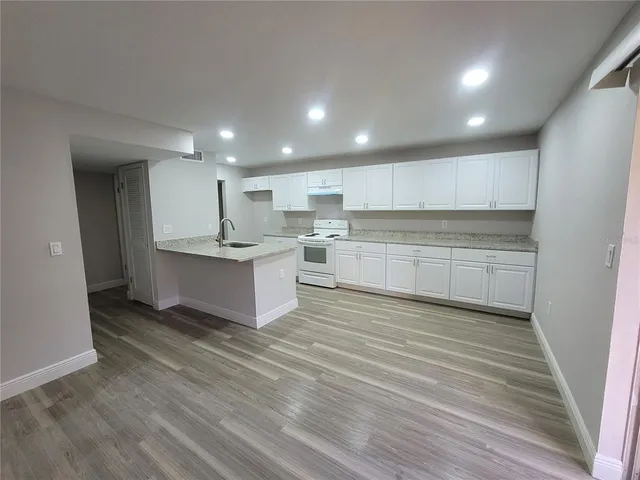 a view of kitchen with wooden floor