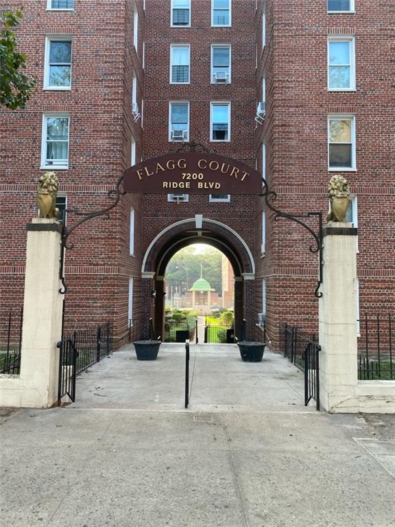 191 73rd Street, Unit 219 Brooklyn, NY 11209 - Photo 1 of 9 a brick building with a bench and a sink