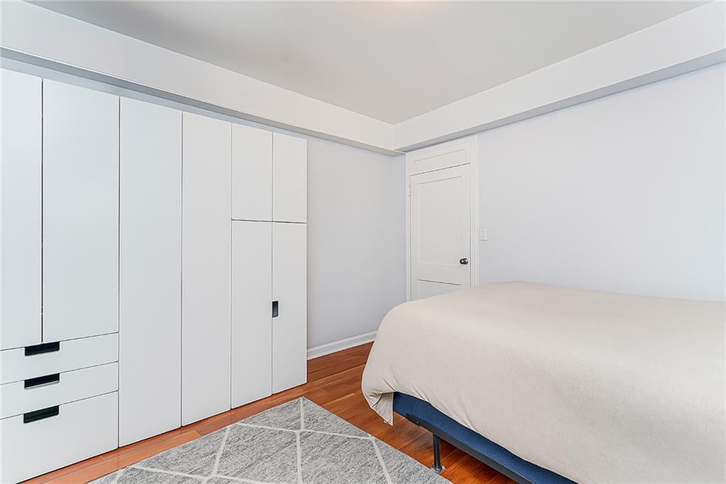 191 73rd Street, Unit 219 Brooklyn, NY 11209 - Photo 5 of 9 a room with a bed and curtain