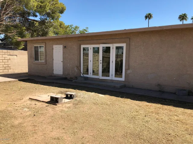 a view of a backyard of the house