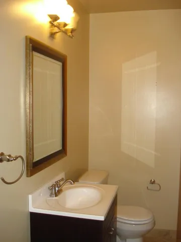 a kitchen with stainless steel appliances granite countertop a sink and a stove