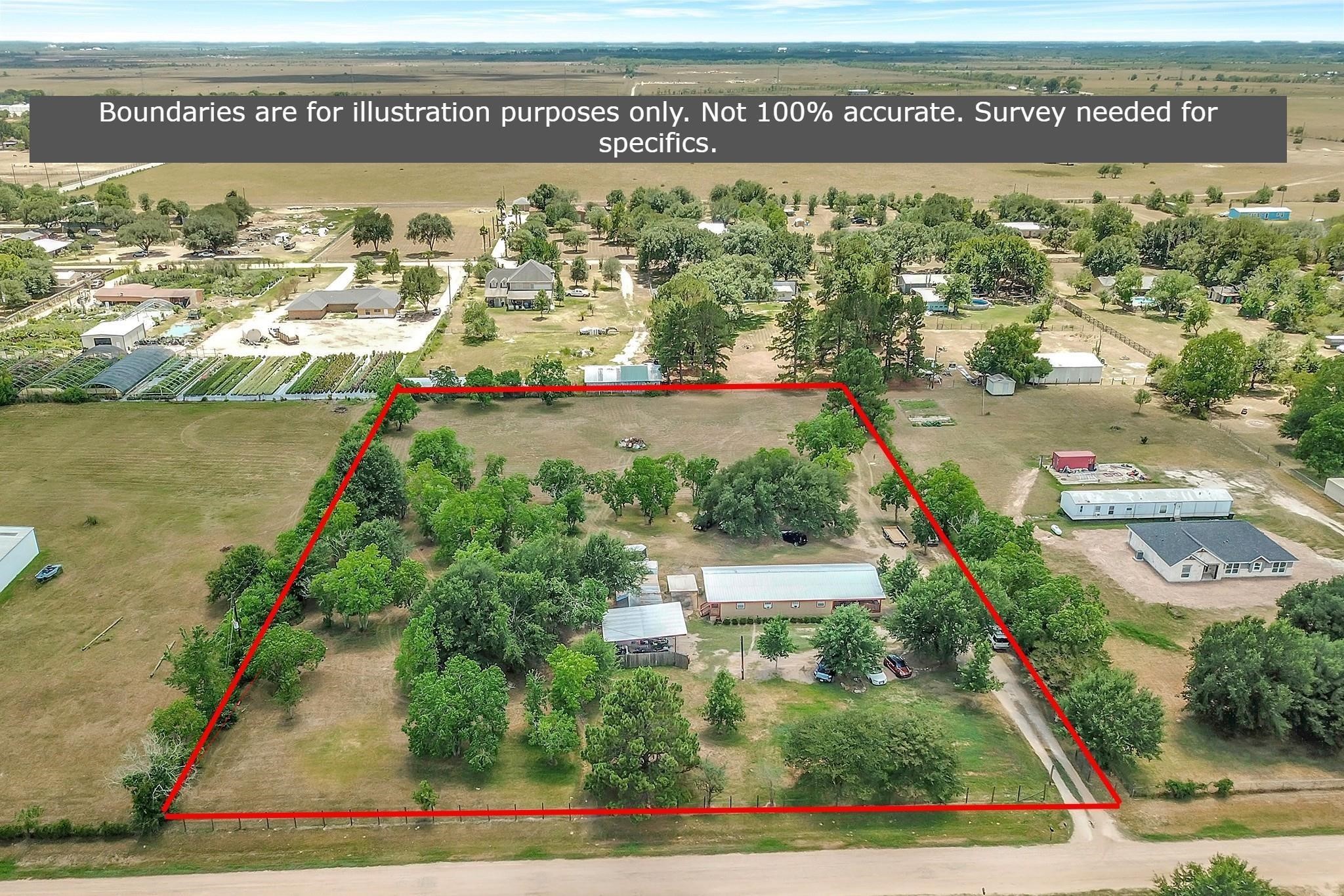 29115 Cherokee Lane Waller, TX 77484 - Photo 45 of 50 This aerial photo shows a rural property outlined in red, featuring a spacious plot with plenty of greenery and trees. It includes a house and several outbuildings, providing privacy and potential for various uses. The surrounding area is open, with neighboring properties visible in the distance.