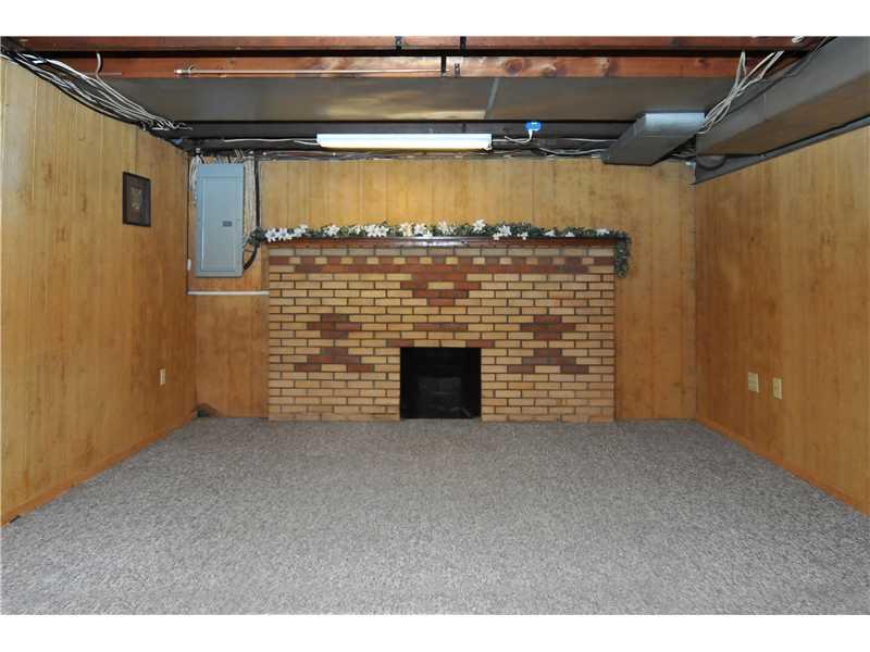 1529 Pine Run Road Rochester, PA 15074 - Photo 14 of 24 Family Room. The lower level just needs the ceiling to complete the finished game room. This is a non workable fire place.