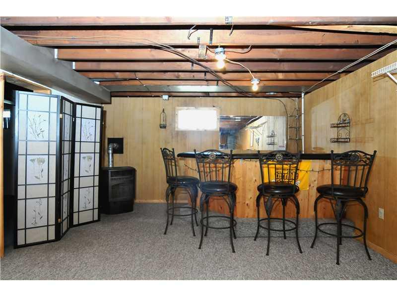 1529 Pine Run Road Rochester, PA 15074 - Photo 15 of 24 Family Room. This bar has a sink that is not yet hooked up & can be relocated. It comes with the 4 bar stools. The pellet stove also stays & there are lots of pellets included.