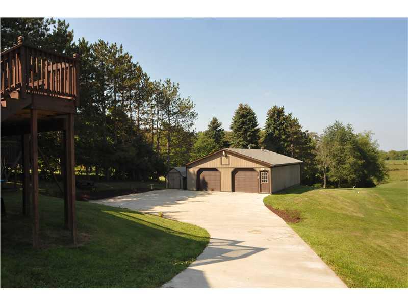 1529 Pine Run Road Rochester, PA 15074 - Photo 23 of 24 Parking Lot/Garage. WOW....cemented driveway from the road to the detached garage. With more than enough parking for company or kids playing without any worries.