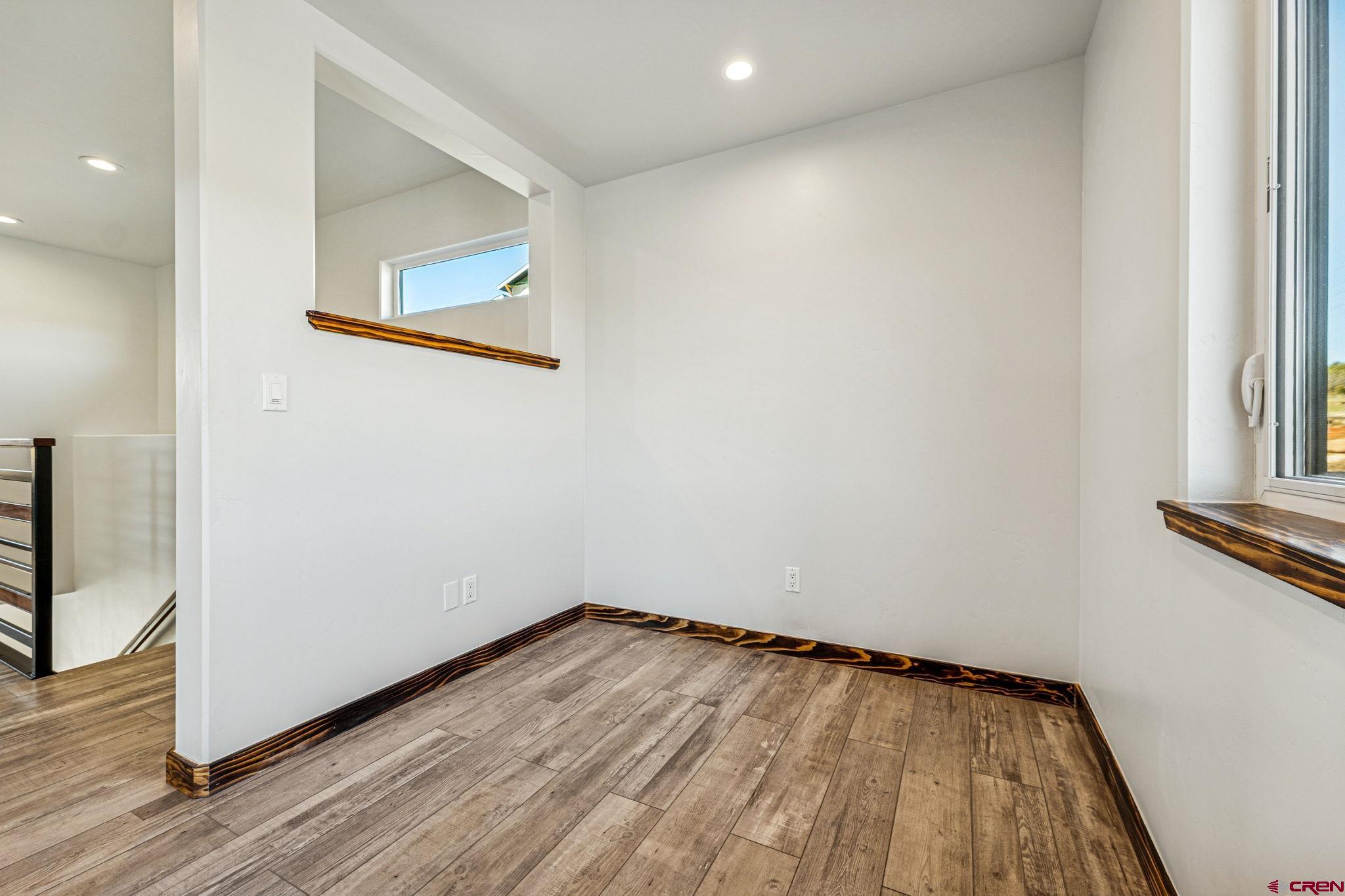 227 Sage View Street Durango, CO 81301 - Photo 22 of 35 a view of a room with wooden floor and a window