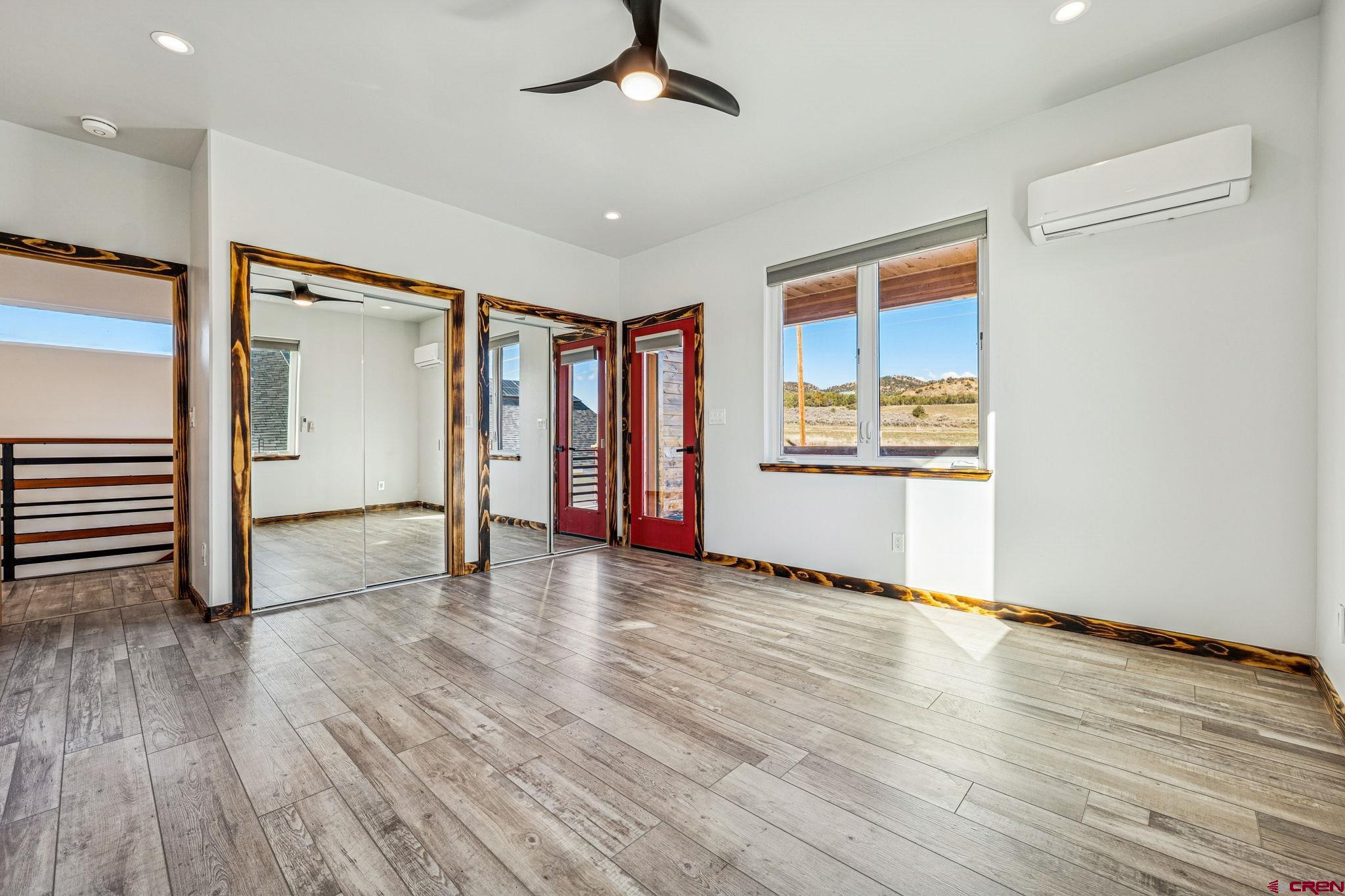 227 Sage View Street Durango, CO 81301 - Photo 24 of 35 wooden floor in an empty room with a window