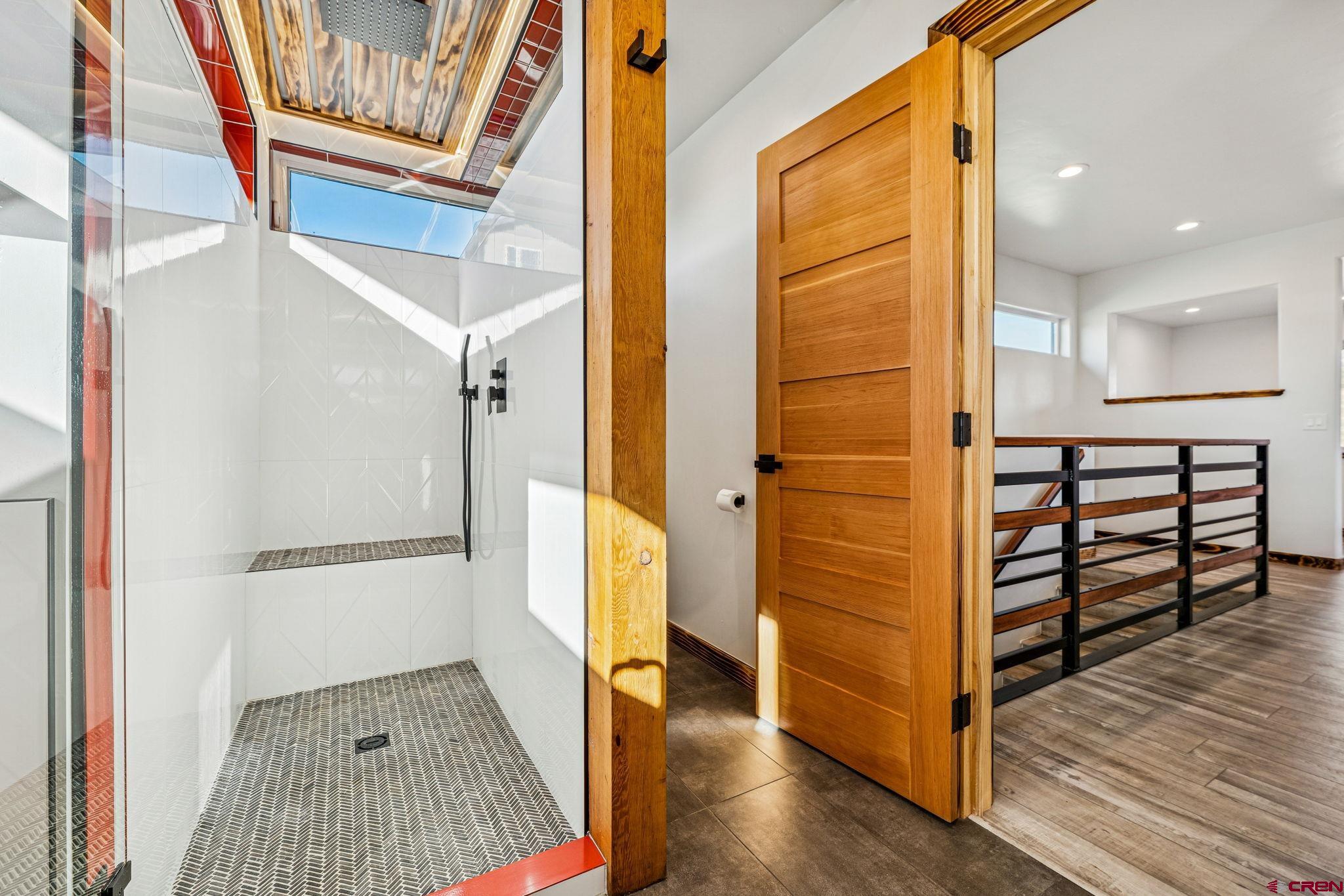 227 Sage View Street Durango, CO 81301 - Photo 29 of 35 a view of a hallway with wooden floor and staircase