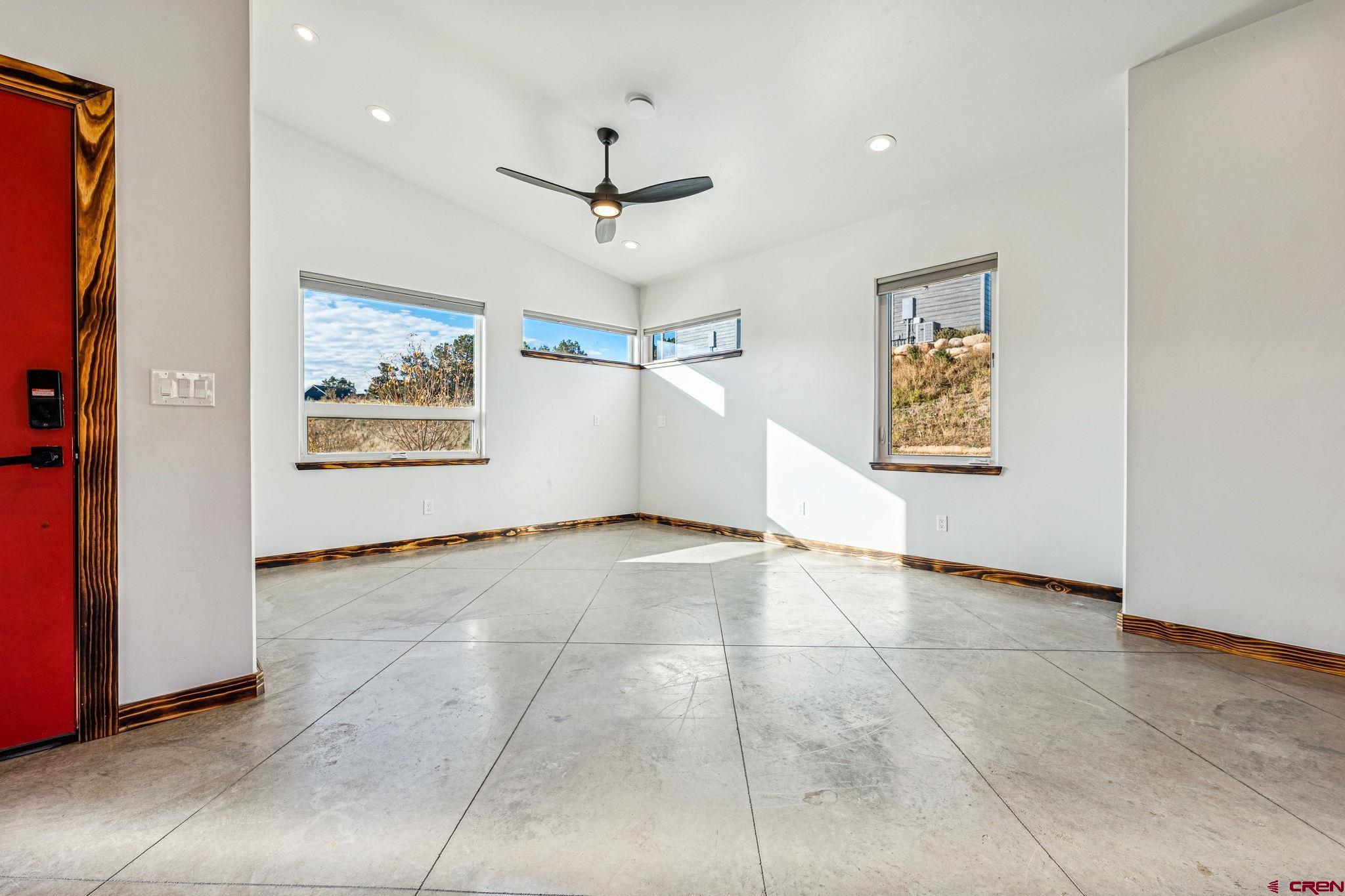 227 Sage View Street Durango, CO 81301 - Photo 5 of 35 a view of an empty room with a window
