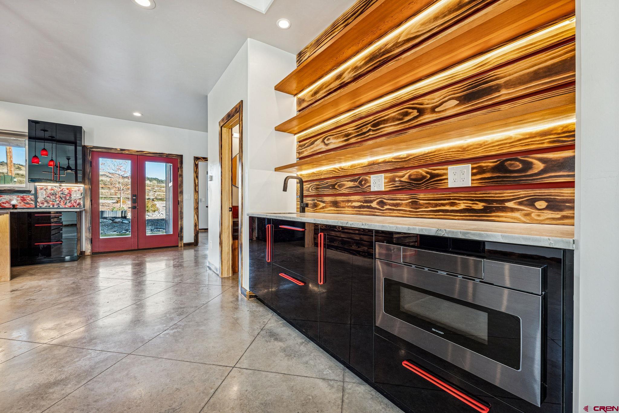 227 Sage View Street Durango, CO 81301 - Photo 7 of 35 a kitchen with stainless steel appliances granite countertop a stove and a microwave