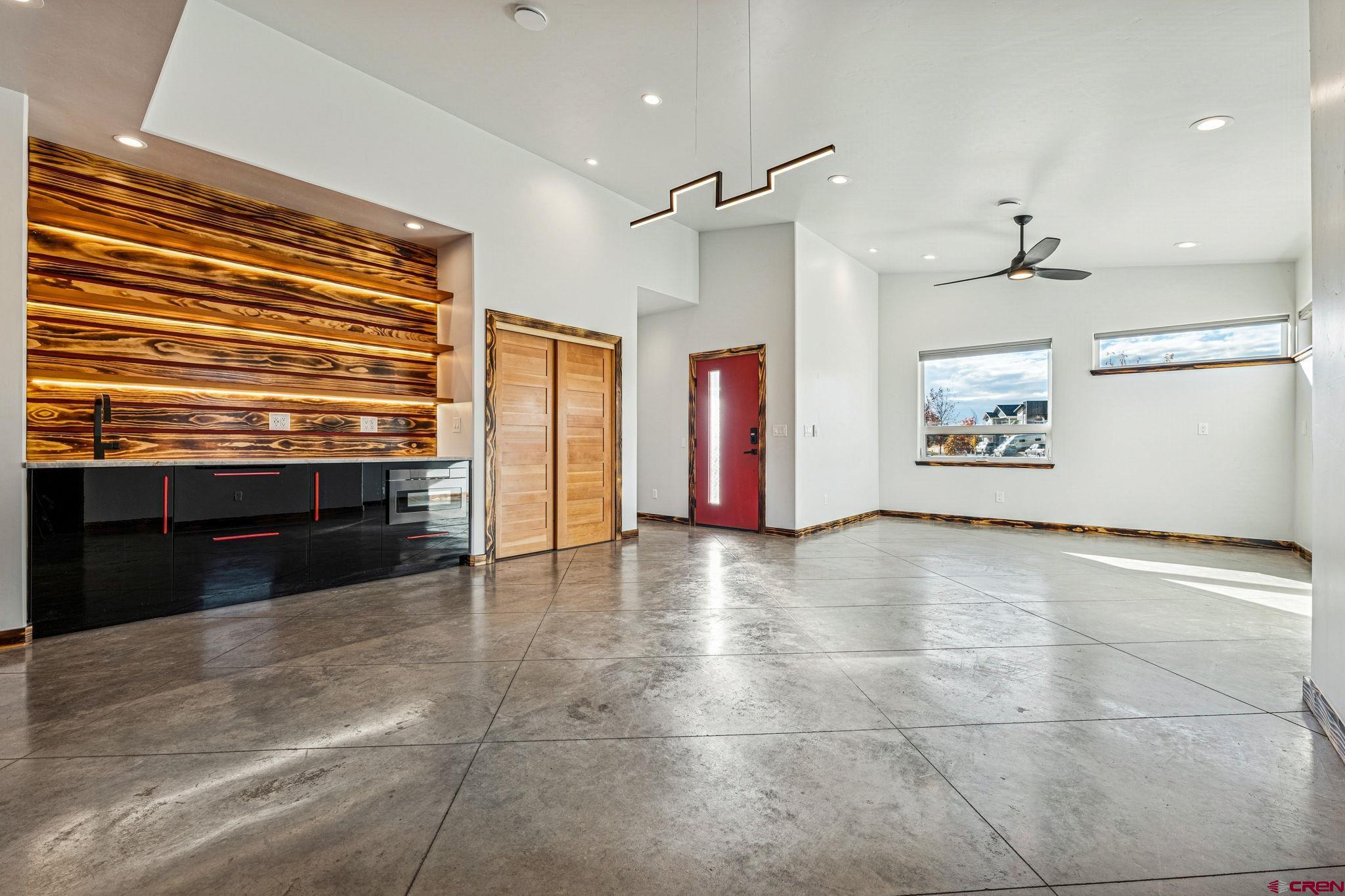 227 Sage View Street Durango, CO 81301 - Photo 9 of 35 a view of an empty room with a stove and kitchen view