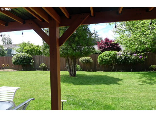 412 Camellia Court Reedsport, OR 97467 - Photo 8 of 48 a view of a backyard with a garden
