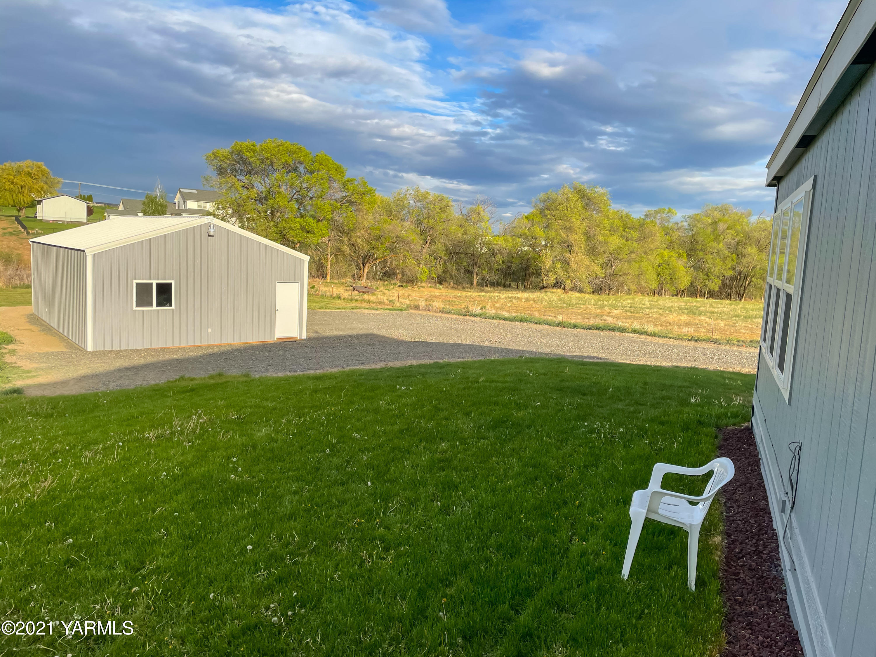 11806 Postma Road Moxee, WA 98936 - Photo 19 of 24 a view of a yard with an outdoor space