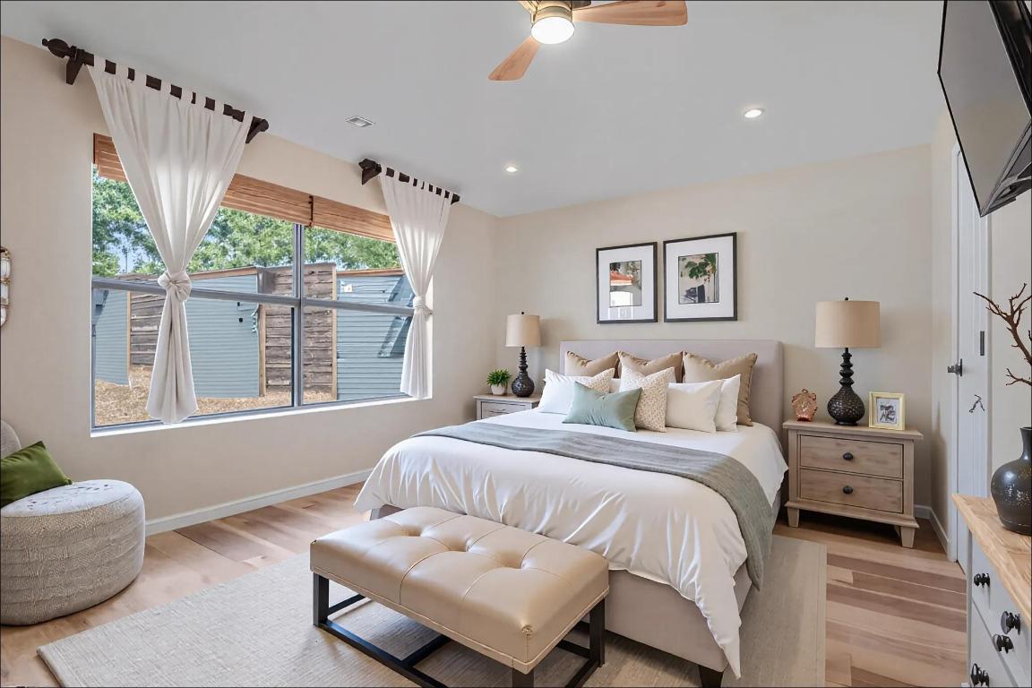 10213 Thomas Lane Dripping Springs, TX 78620 - Photo 15 of 40 a bedroom with a bed and a couch