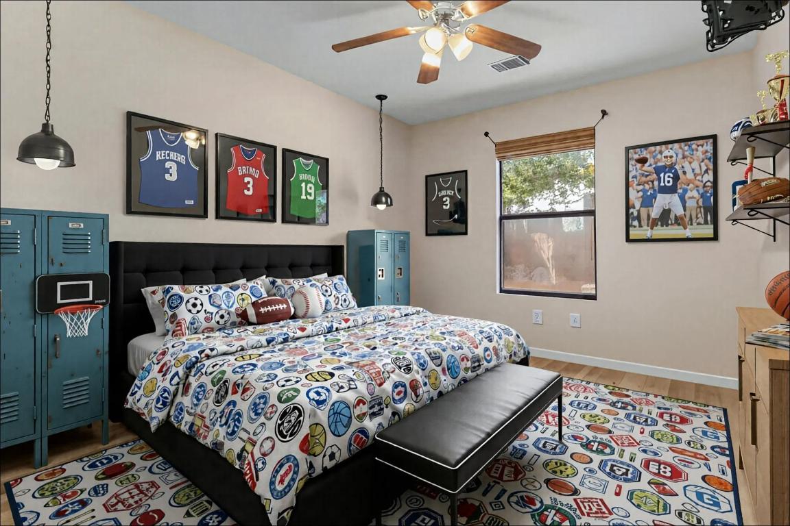 10213 Thomas Lane Dripping Springs, TX 78620 - Photo 19 of 40 a bedroom with a bed and a chandelier