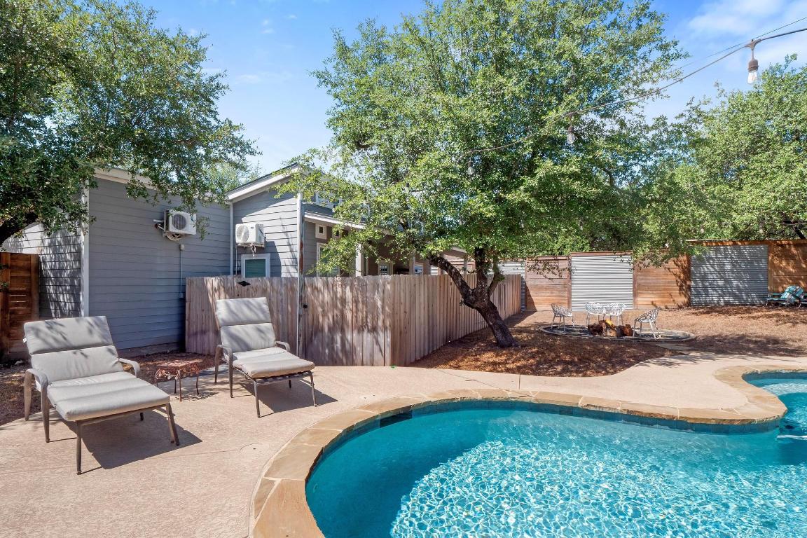 10213 Thomas Lane Dripping Springs, TX 78620 - Photo 26 of 40 a view of backyard with a patio and outdoor seating