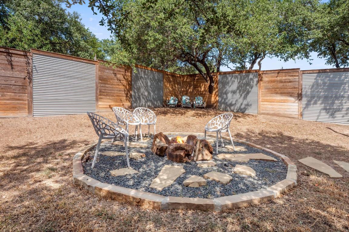 10213 Thomas Lane Dripping Springs, TX 78620 - Photo 27 of 40 a view of a backyard with sitting area