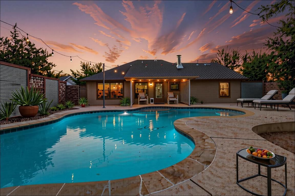 10213 Thomas Lane Dripping Springs, TX 78620 - Photo 3 of 40 a front view of a house with swimming pool yard and outdoor seating