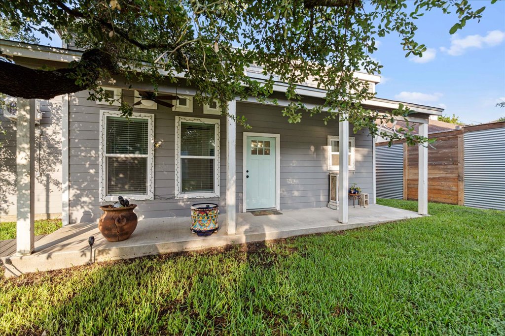10213 Thomas Lane Dripping Springs, TX 78620 - Photo 36 of 40 a front view of a house with a garden and plants